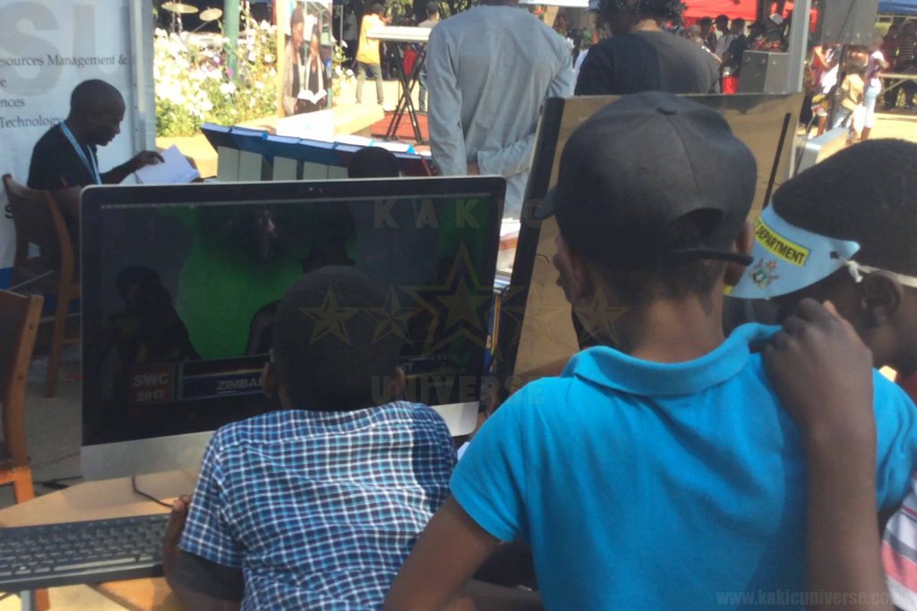 Children watching Jah Kaylite at GIBF
